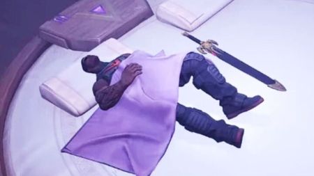 Blade is sound asleep next to his actual blade in a white bed, from a Marvel Rivals screenshot