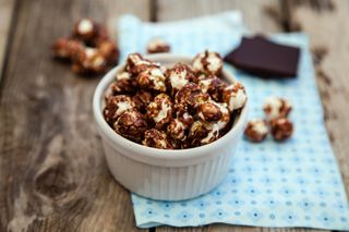 Maltesers popcorn balls in a bowl covered in chocolate