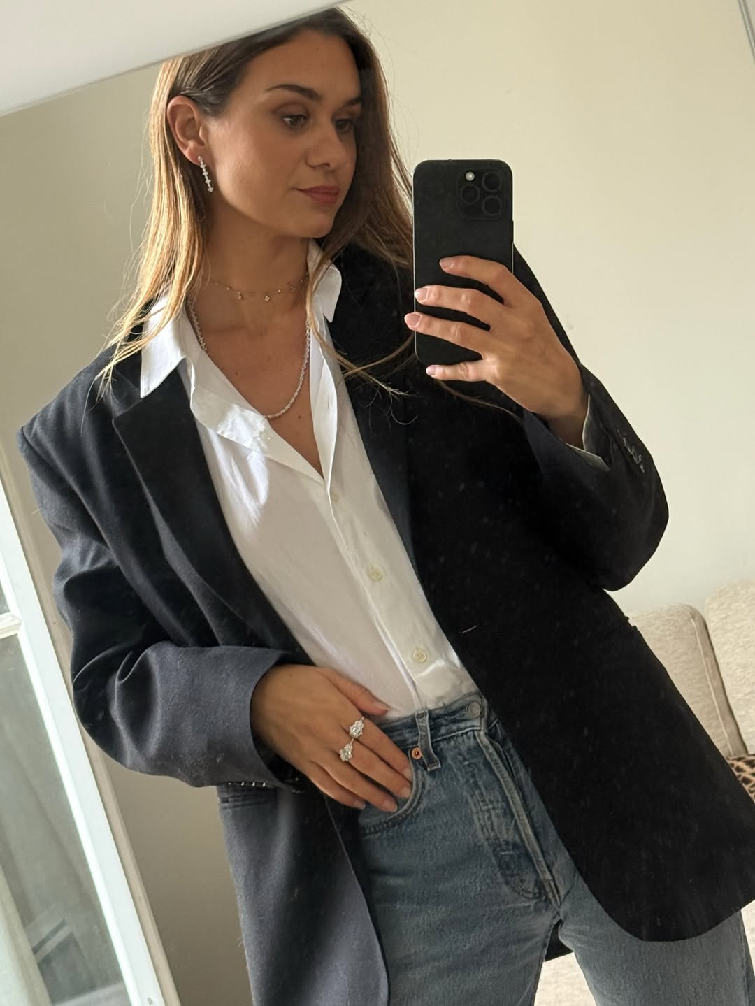 Anne-Laure wearing statement rings and a blazer