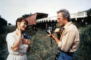 Clint Eastwood and Meryl Streep flirt holding cameras
