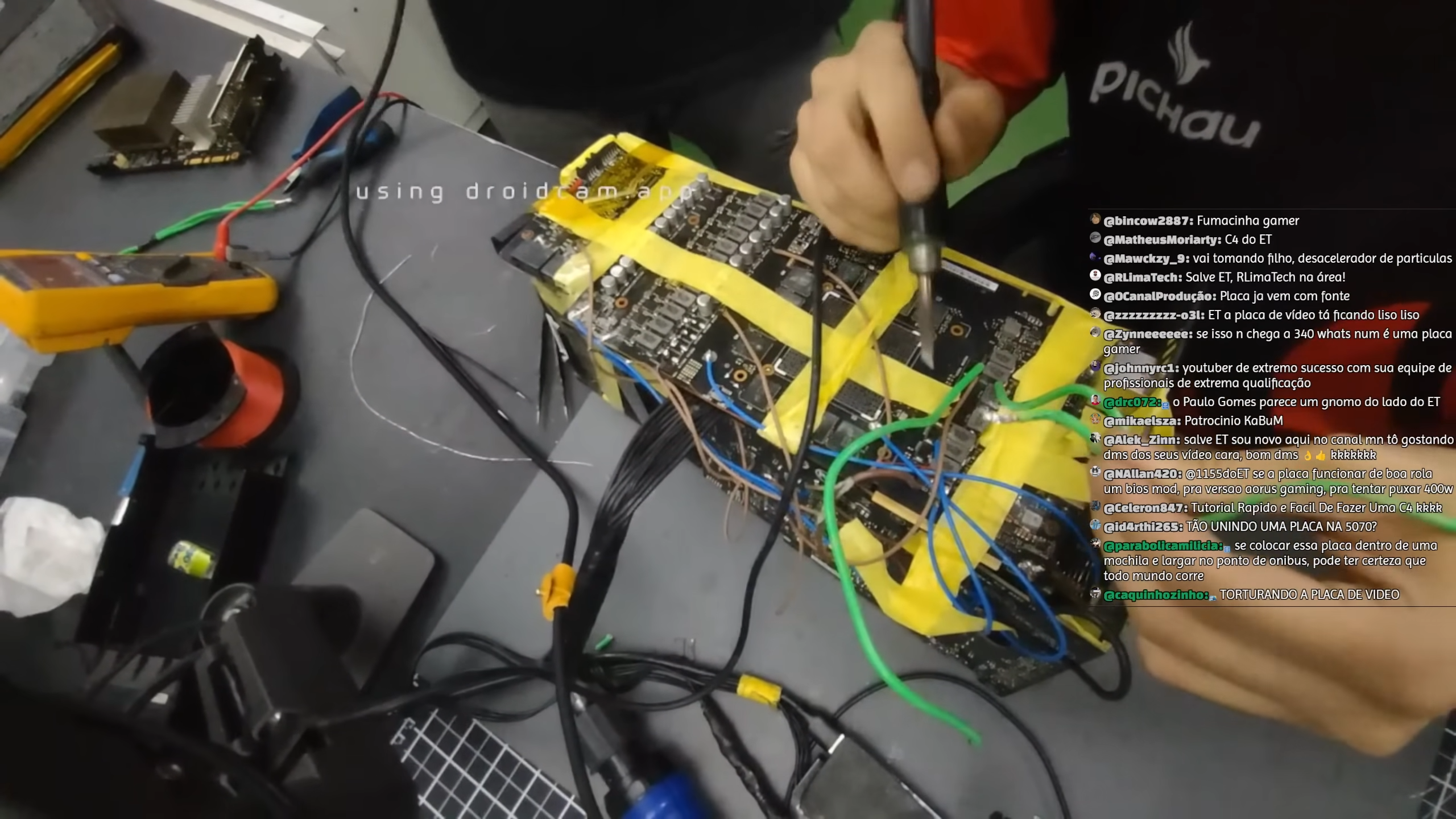 Frankenstein RTX 5070 Ti being soldered, with wires and electrical tape very visible