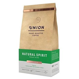 Union Organic Coffee Beans in a brown paper bag with a green stripe across it