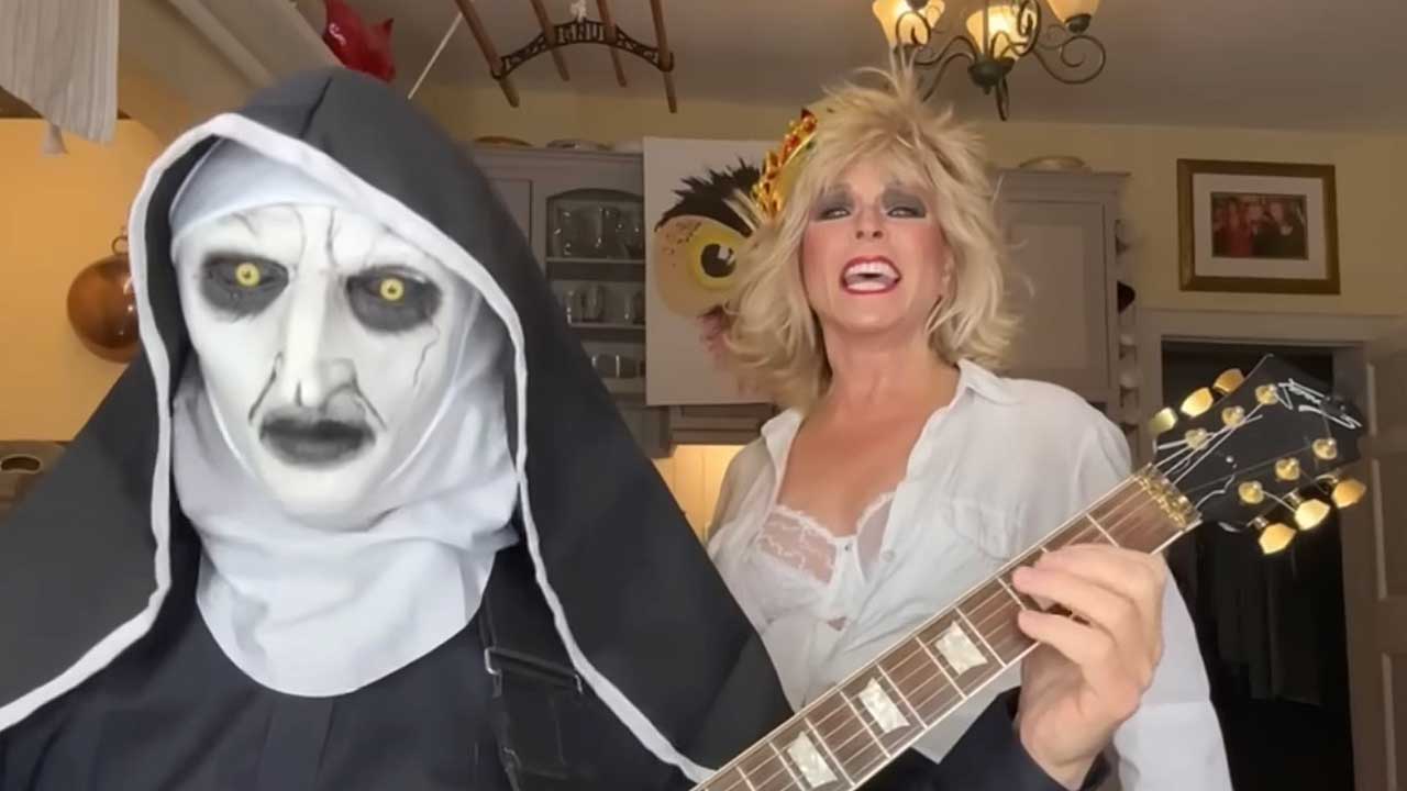 Robert Fripp dressed as a satanic nun and Toyah in their kitcxhen