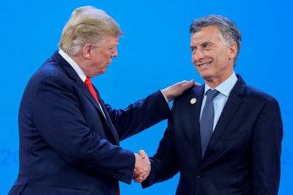 Argentine President Mauricio Macri greets President Trump