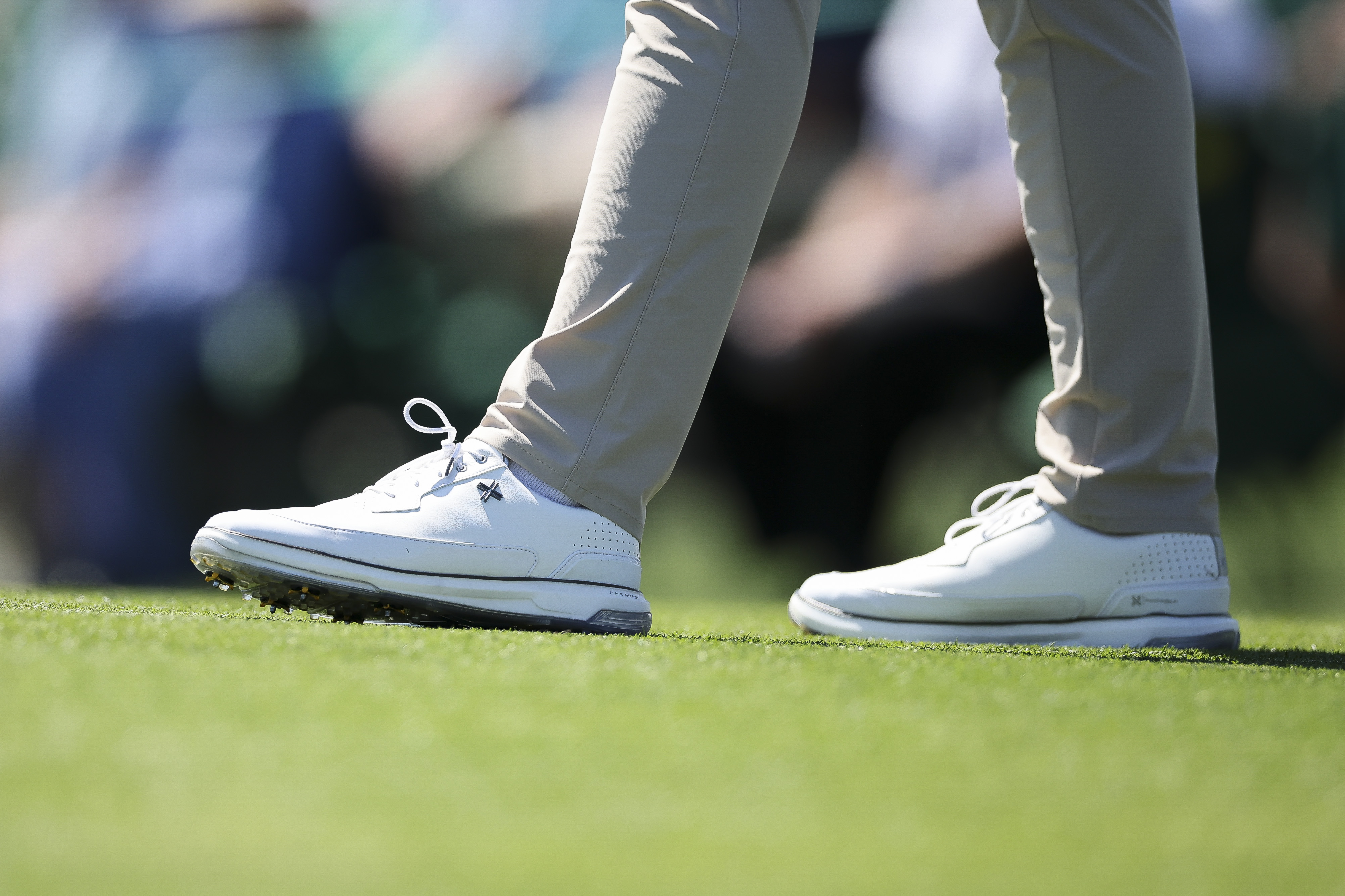 A detailed view of the shoes worn by Sam Burns of the United States during the first round of the 2026 Masters Tournament at Augusta National Golf Club