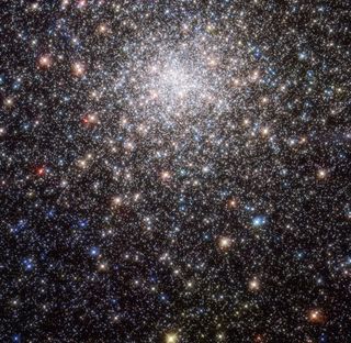 In this Hubble Space Telescope view of the globular cluster Messier 28, countless multicolored stars stand out as specks in a glittering cosmic sea. But when the astronomer Charles Messier first observed the cluster in the 18th century, he mistook it for a starless nebula, or a cloud of dust and gas. Larger telescopes later revealed that Messier 28 is in fact a rich star cluster. Located nearly 18,000 light-years from Earth in the constellation Sagittarius, this cluster contains at least 50,000 stars.