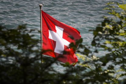 The Swiss flag flies in the wind