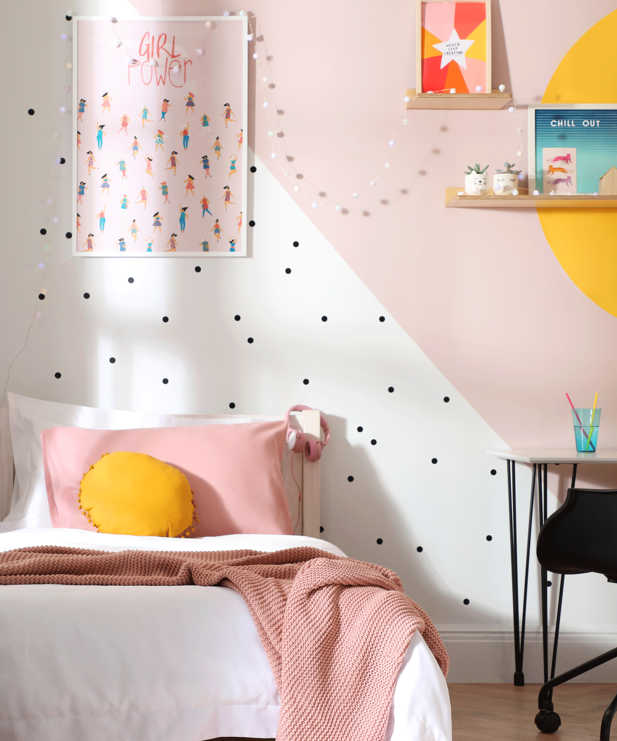 Kid's bedroom in pastel hues with two-tone wall zones and washi tape polka dots.