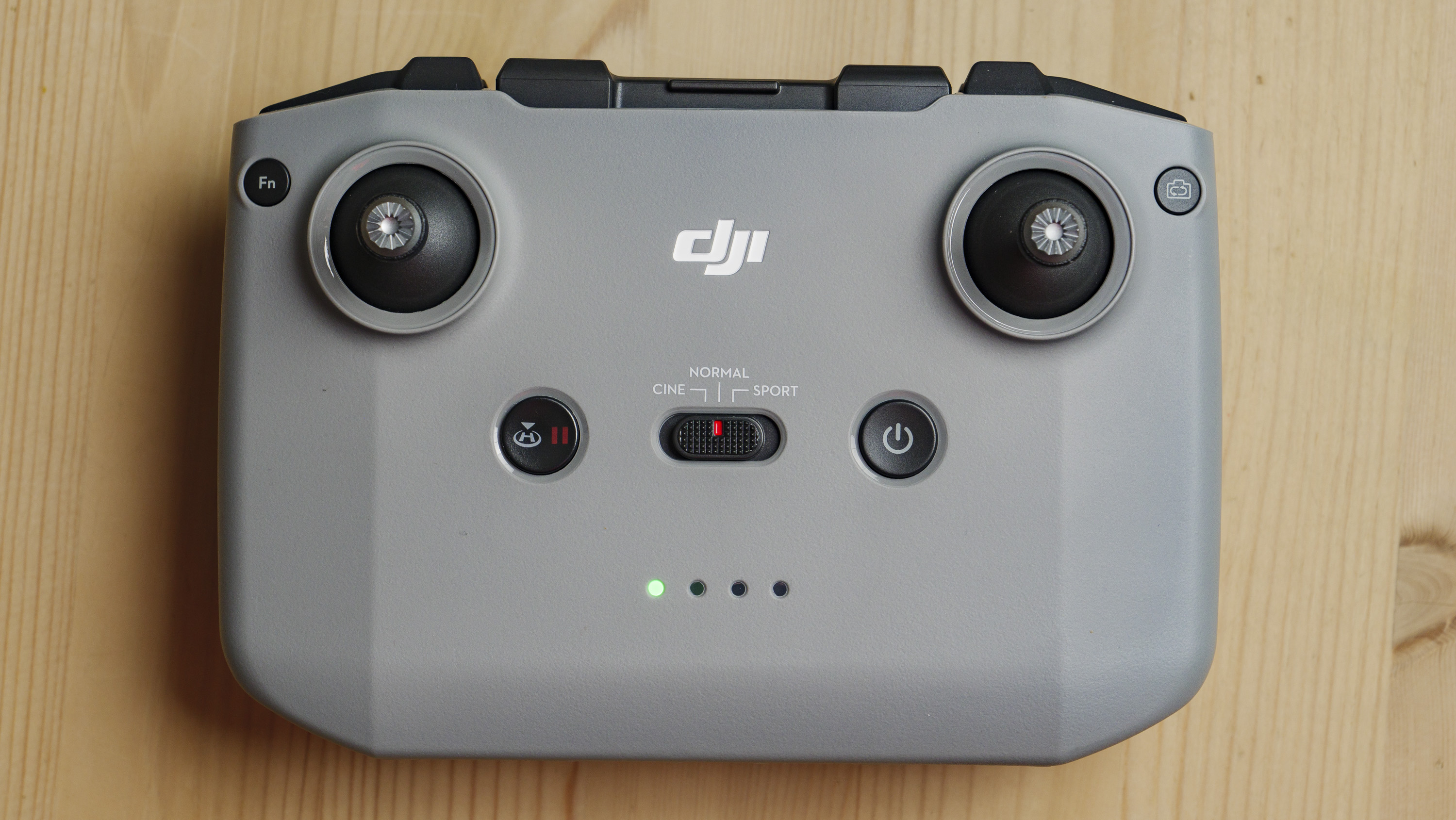 DJI Mini 4K's RC controller on a wooden table