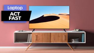 Samsung 43-inch Class TU690T TV on a tanle against a rose pink background 