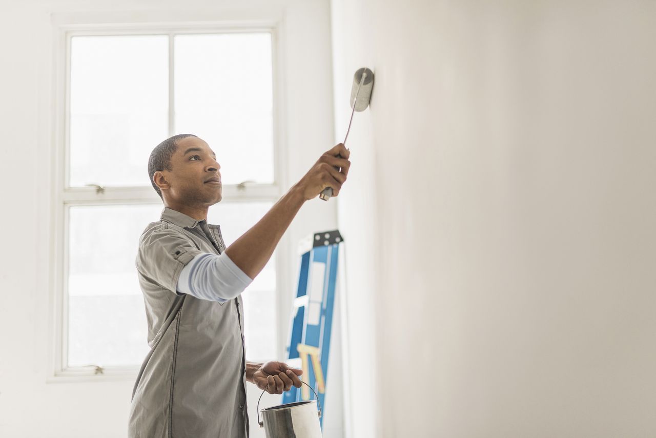 man painting a room