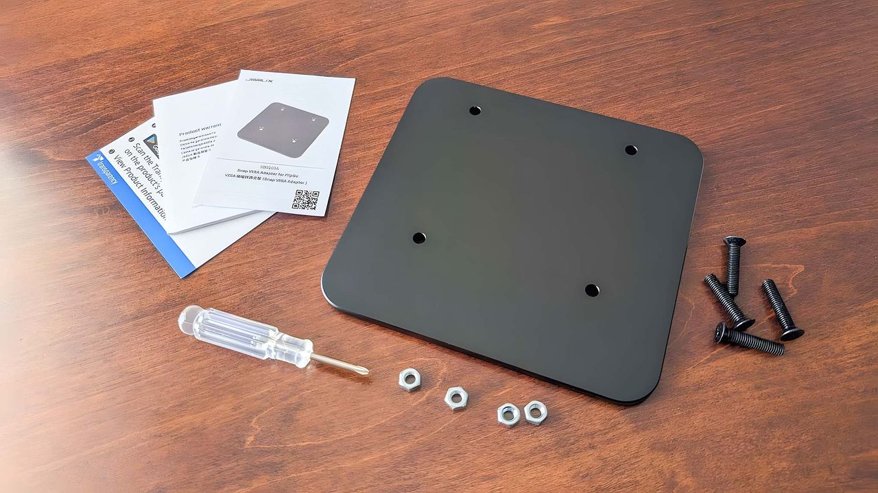 JSAUX VESA adapter, screws, nuts, screwdriver, and manuals.
