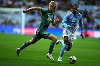 Lucas Bergvall of Tottenham Hotspur goes past Haji Wright during the Carabao Cup Third Round match between Coventry City and Tottenham Hotspur at The Coventry Building Society Arena on September 18, 2024 in Coventry, England.