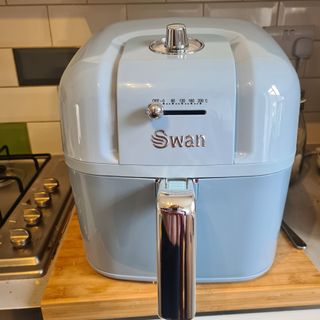 Swan Retro air fryer in blue on a kitchen counter
