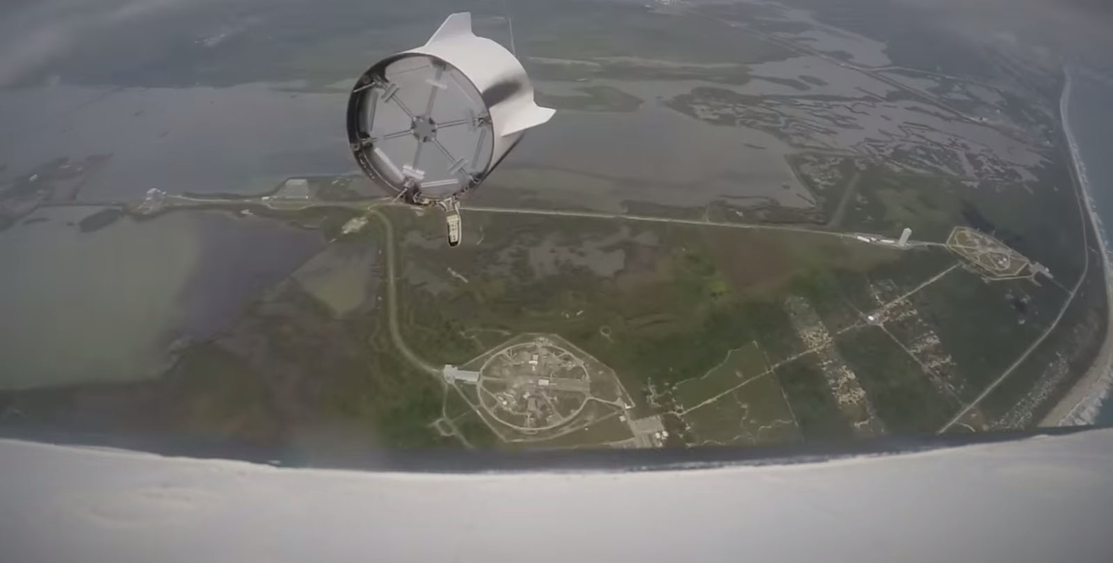 SpaceX&#039;s first Dragon crew capsule separates from its finned trunk section (seen at upper left) in this still image from a video recorded by an onboard camera during a May 6, 2015 launch abort system test in Florida&#039;s Cape Canaveral Air Force Station.