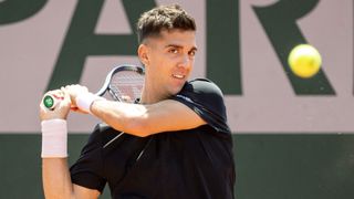 Thanasi Kokkinakis swings a backhand at the French Open 2023