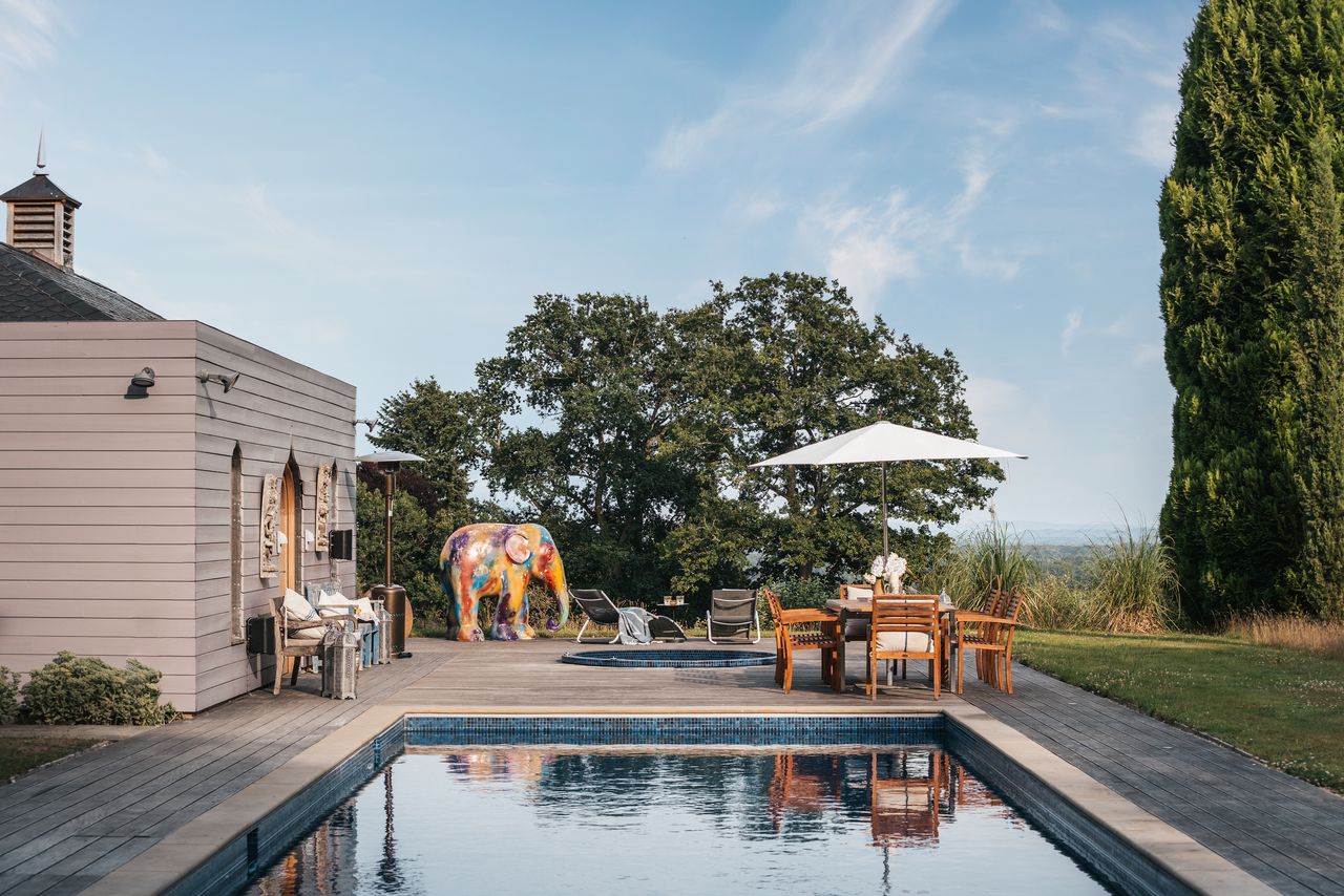 Pool house with dining table and decking 