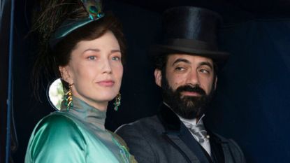 Bertha and George look out of a carriage window