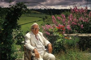 Laurie Lee, author in the garden of his home in Slad, Gloucestershire, in 1994.