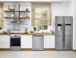 white kitchen with stainless steel large appliances