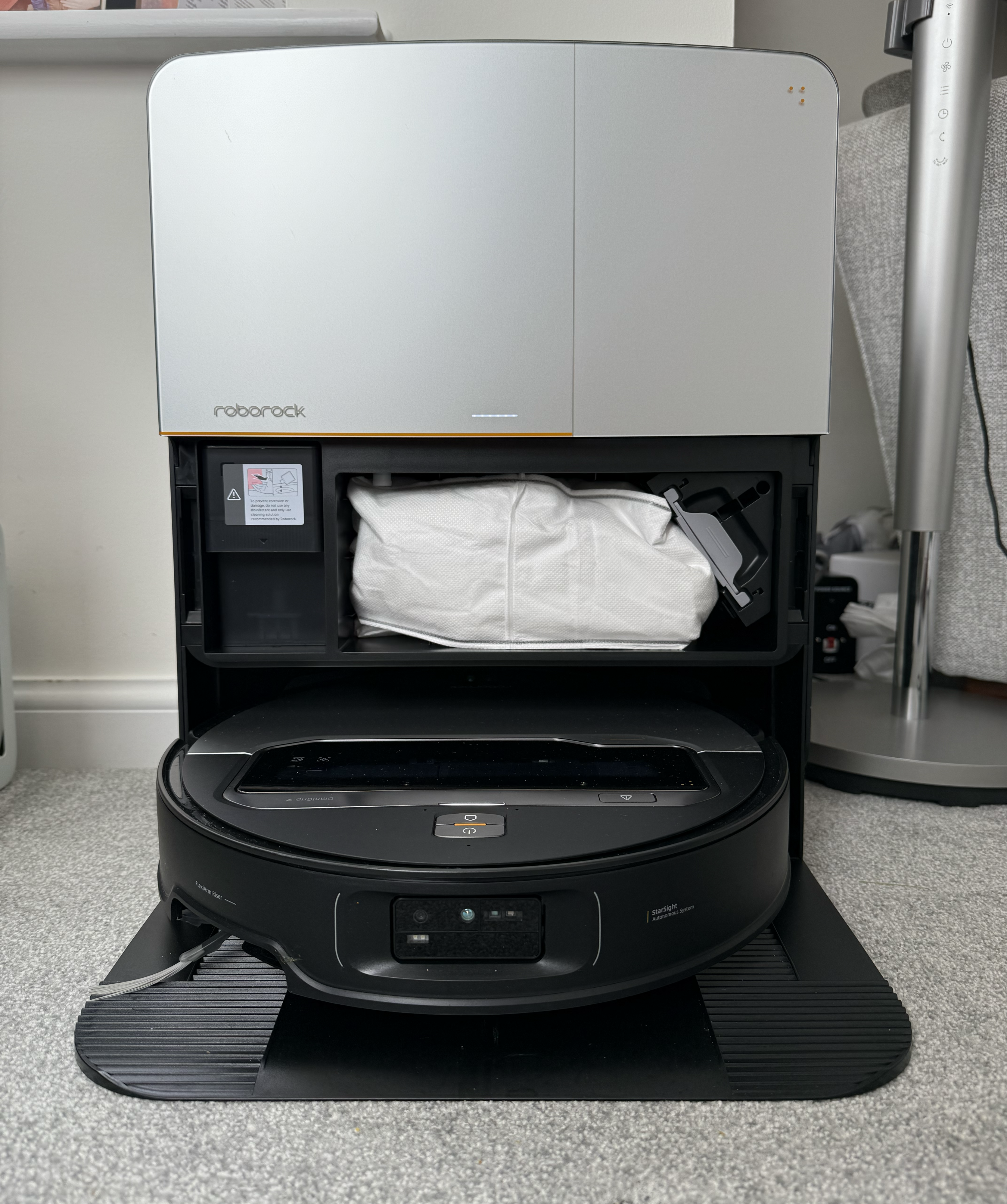Inside the Roborock Saros Z70 cleaning station revealing vacuum bag