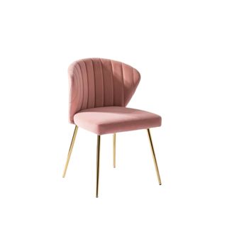 A pink velvet chair with gold legs