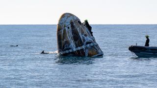 Support teams work around the SpaceX Crew-9 Dragon spacecraft shortly after it landed with NASA astronaut and Space Force Col. Nick Hague, as well as fellow NASA astronauts Suni Williams and Butch Wilmore and Roscosmos cosmonaut Aleksandr Gorbunov aboard in the water off the coast of Tallahassee, Florida on March 18, 2025. 