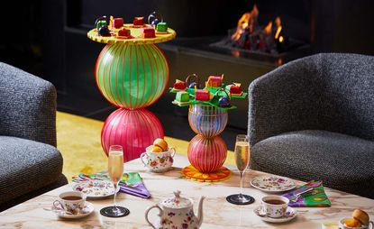 colouful cakestands with cakes at Bulgari afternoon tea designed by Yinka Ilori