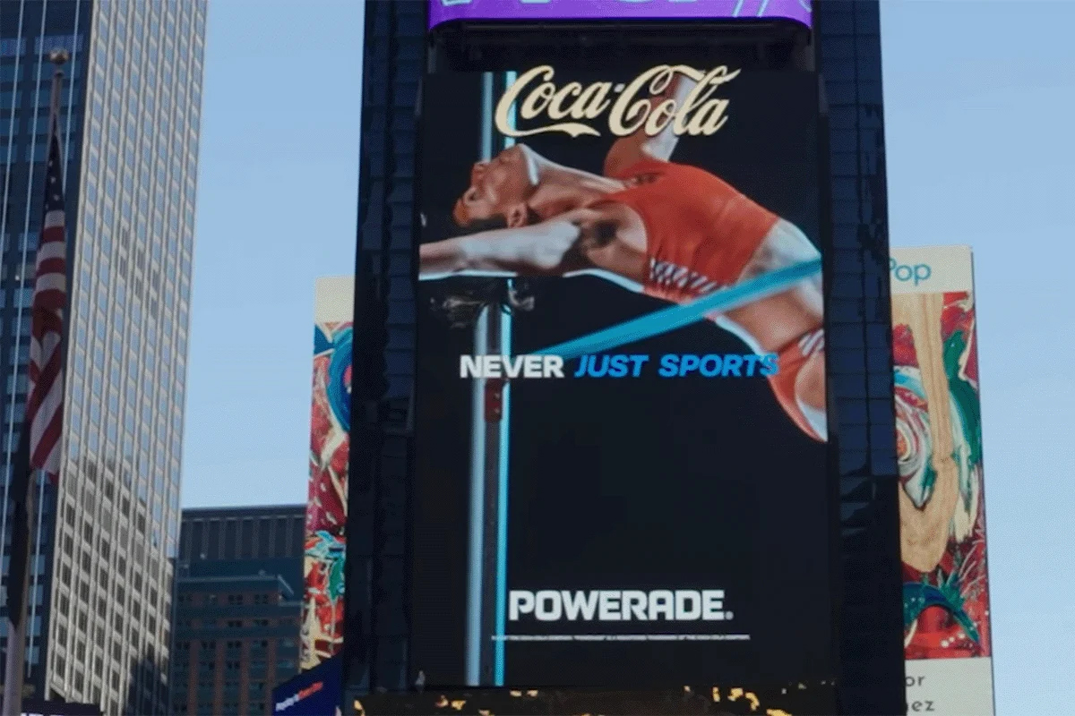 A woman jumps a bar in a billboard ad