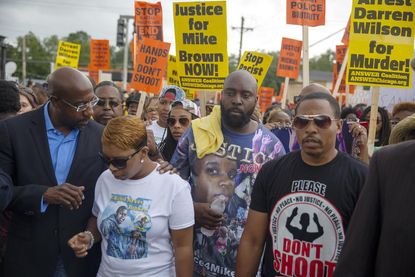 3 weeks after Michael Brown's death, Ferguson holds peaceful march