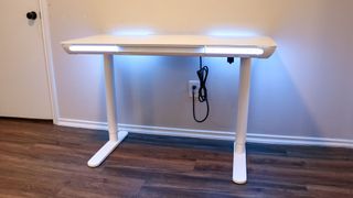 The LiftSync Clear Plus standing desk with its integrated RGB lights turned on