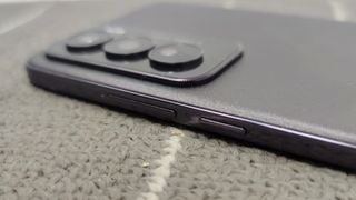 The Oppo Reno 12 Pro on a gray and white background.