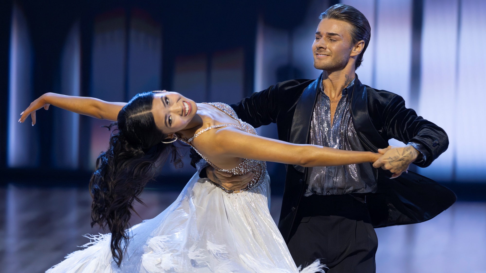 Dancing with the Stars: The Next Pro contestants Natalie Jolley and Erik Linder dancing together during a challenge.