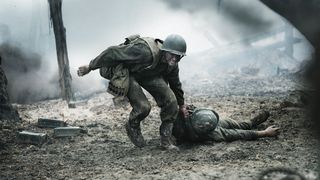 Desmond Doss drags a soldier on the battlefield in Hacksaw Ridge.