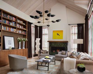 white living room with a green fireplace and neutral furniture