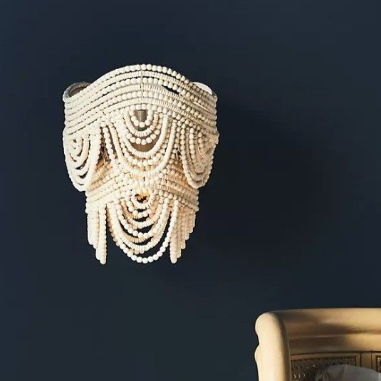 Beaded wall sconce
