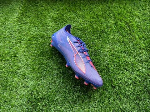 Puma Ultra 5 Ultimate football boots placed on a piece of astro turf ready to be reviewed