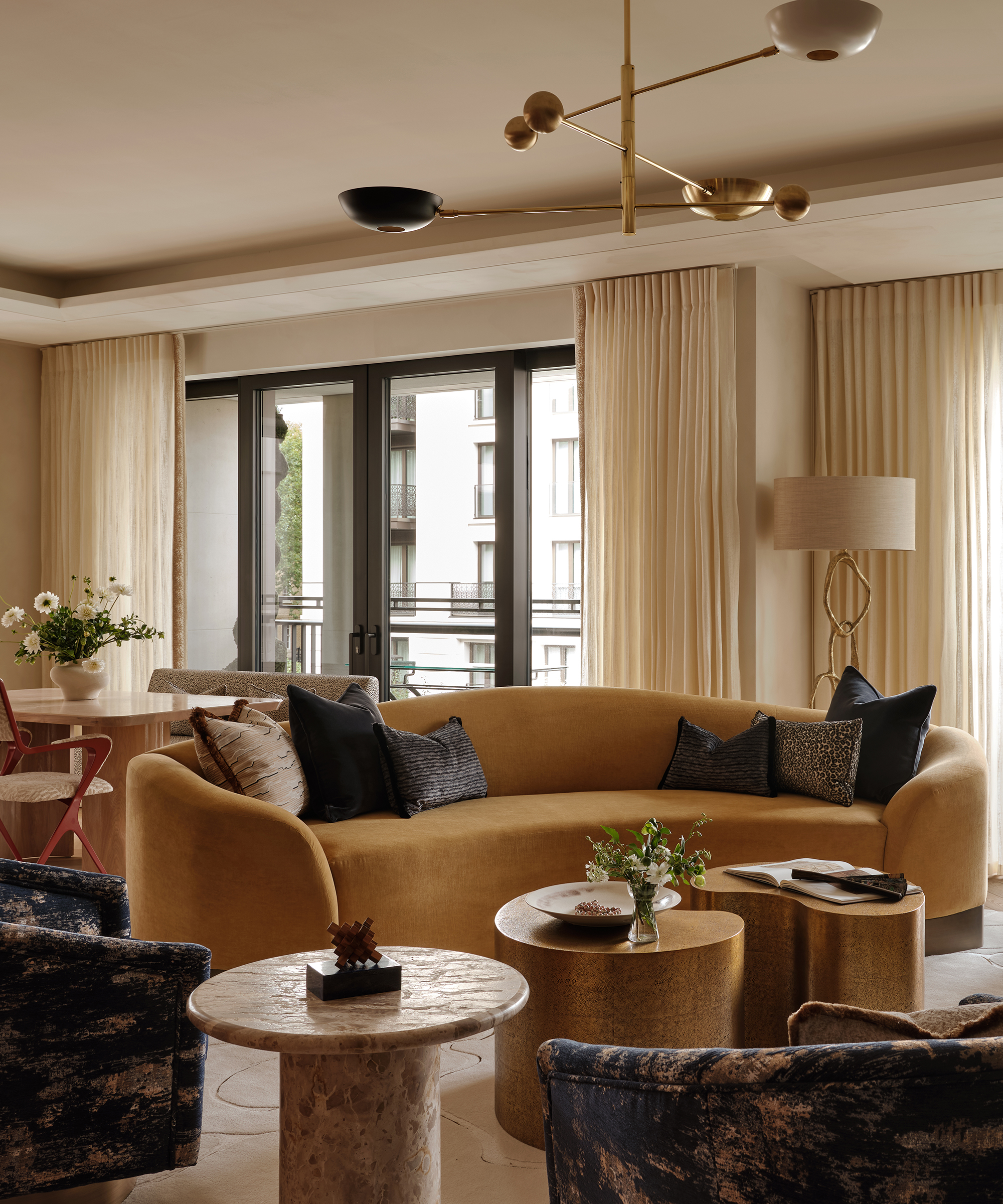 living room with yellow sofa, large overheard light and floor lamp in the corner