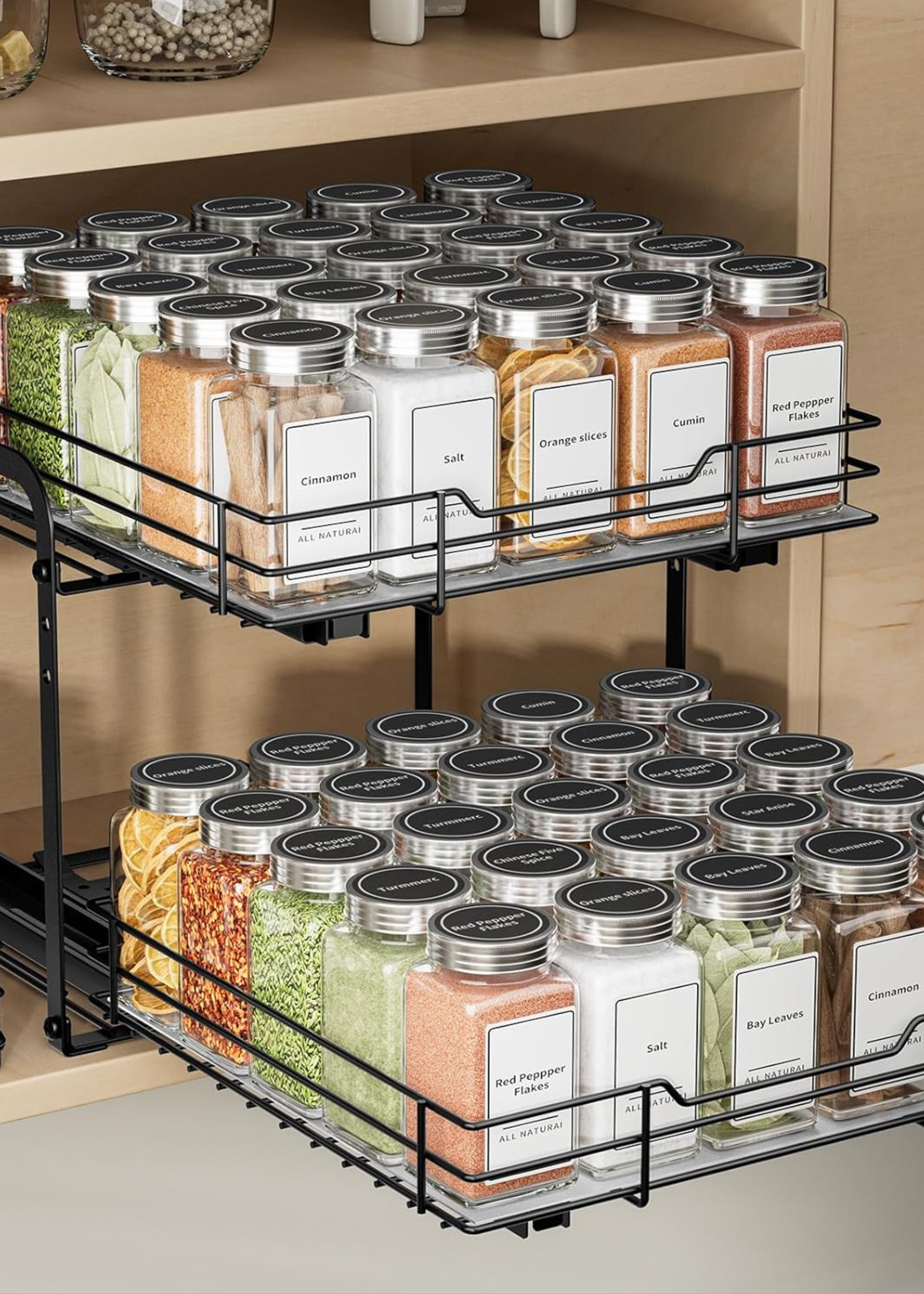 A pull-out spice rack with two tiers of bottles