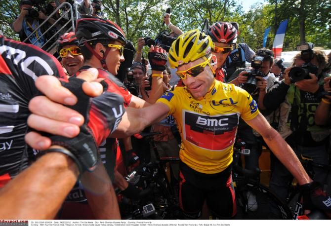 Cadel Evans celebrates the 2011 Tour de France win his his BMC teamamtes