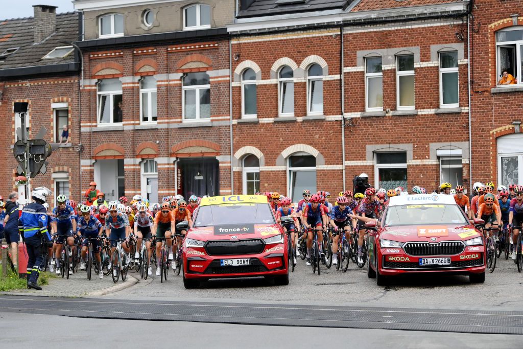 LIEGE BELGIUM AUGUST 14 A general view of the peloton stopped due to a train crossing during the 3rd Tour de France Femmes 2024 Stage 4 a 1227km stage from Valkenburg to Liege UCIWWT on August 14 2024 in Liege Belgium Photo by Alex BroadwayGetty Images
