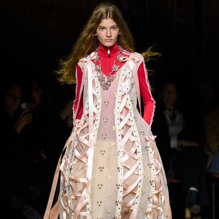 Runway image of a Simone Rocha model from London Fashion Week AW/26 wearing a gown with adidas top