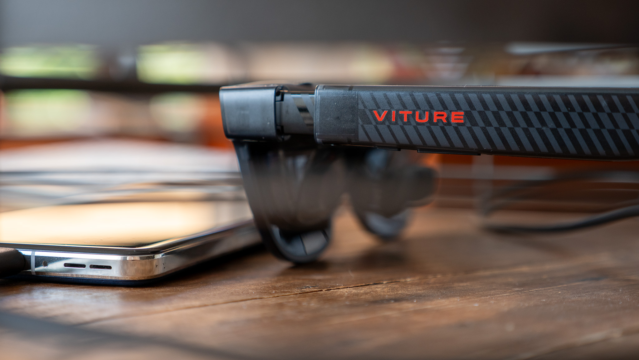 A pair of Viture Luma Pro glasses connected to the Spacewalker app running on a OnePlus 13