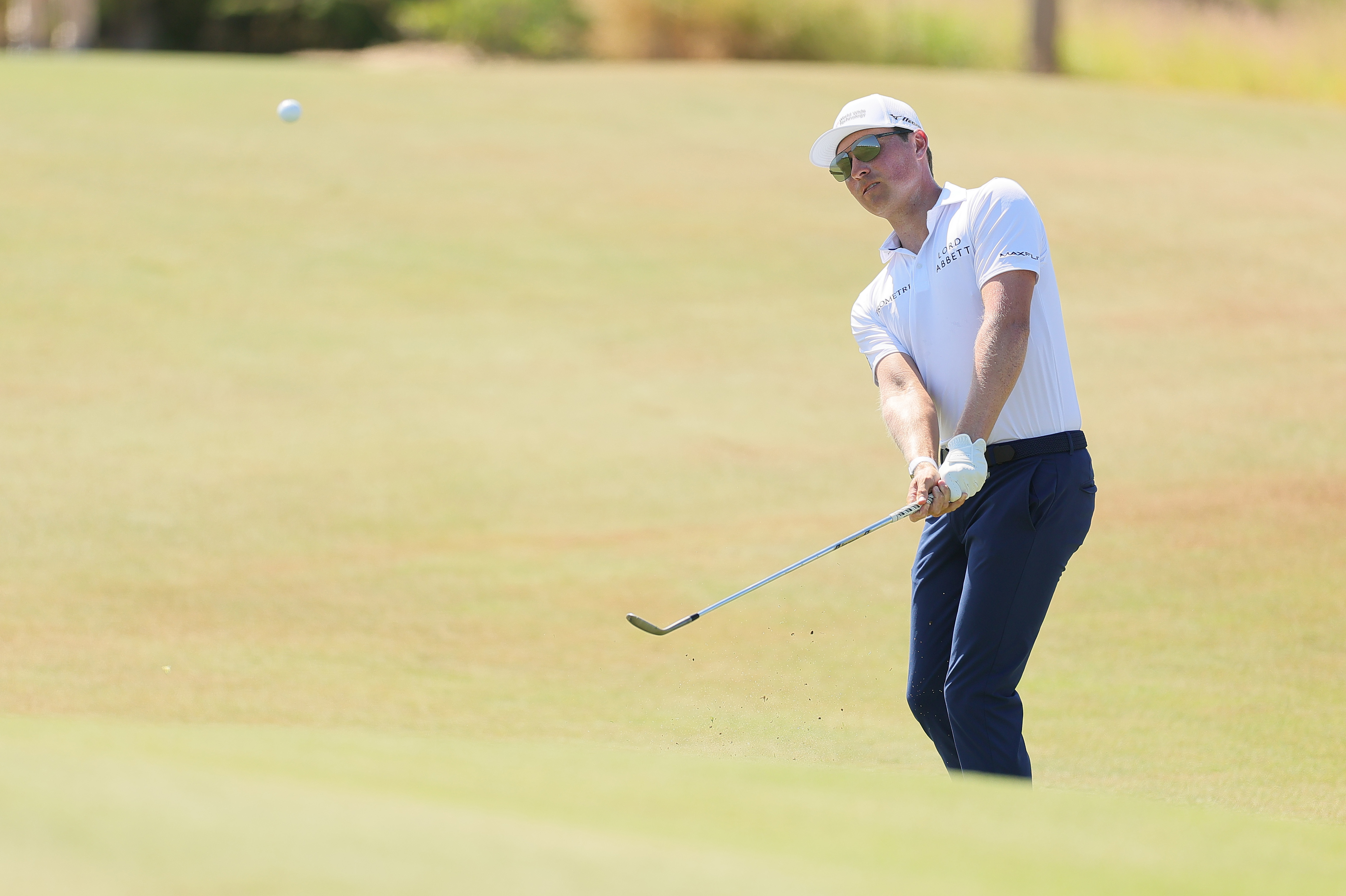 Ben Griffin strikes a pitch shot 