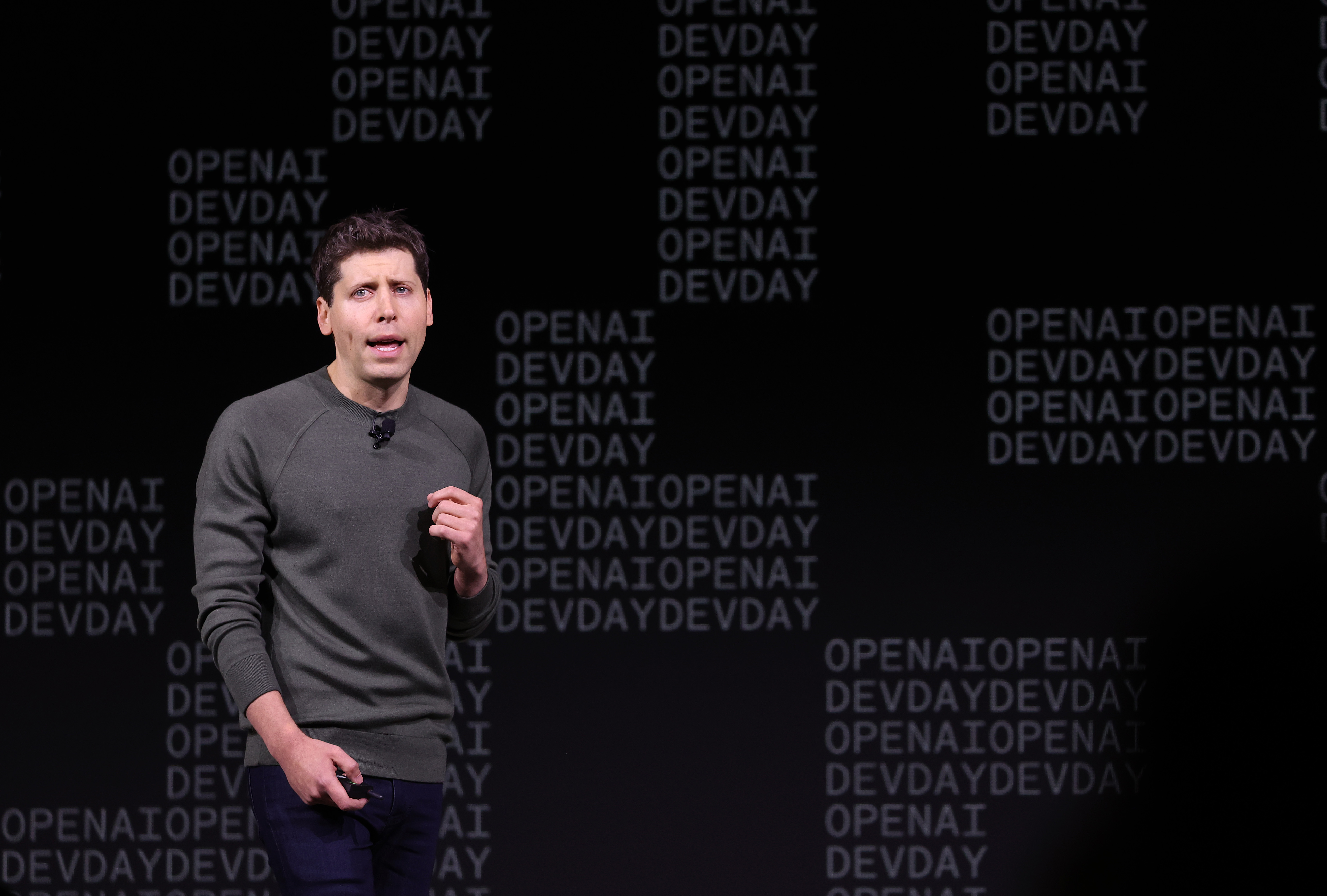 OpenAI CEO Sam Altman speaking at the firm's inaugural developer day in November 2023