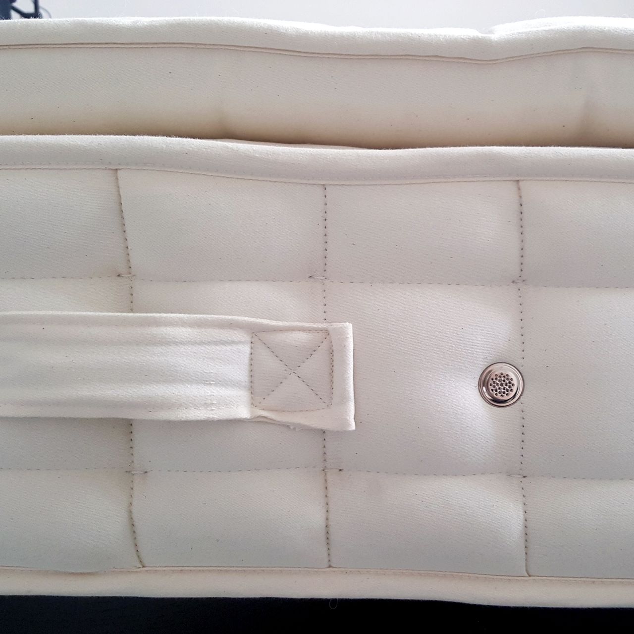 A close up of the Hypnos Pillow Top Classic mattress side handles