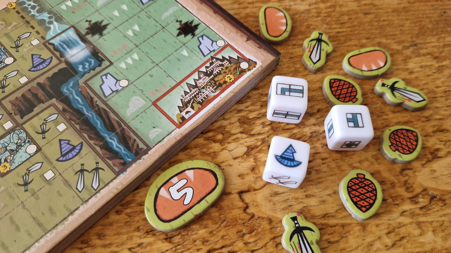 The Hobbit: There &amp;amp; Back Again components laid out on a wooden surface