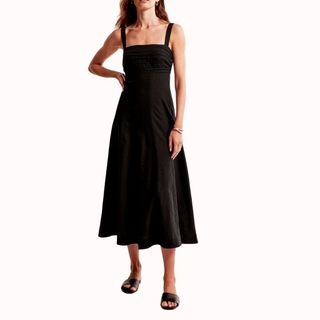 Flat lay image of woman wearing black dress