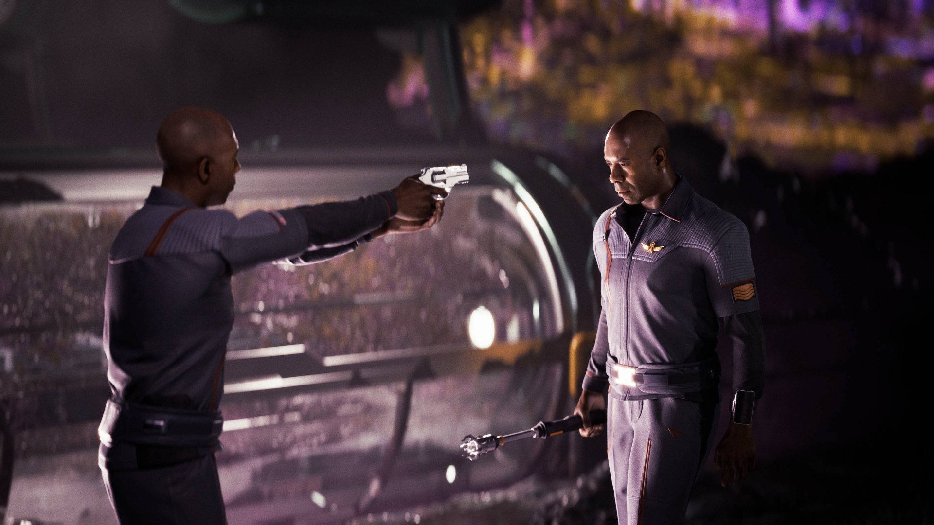 Someone pointing a gun at another person who looks exactly like them.