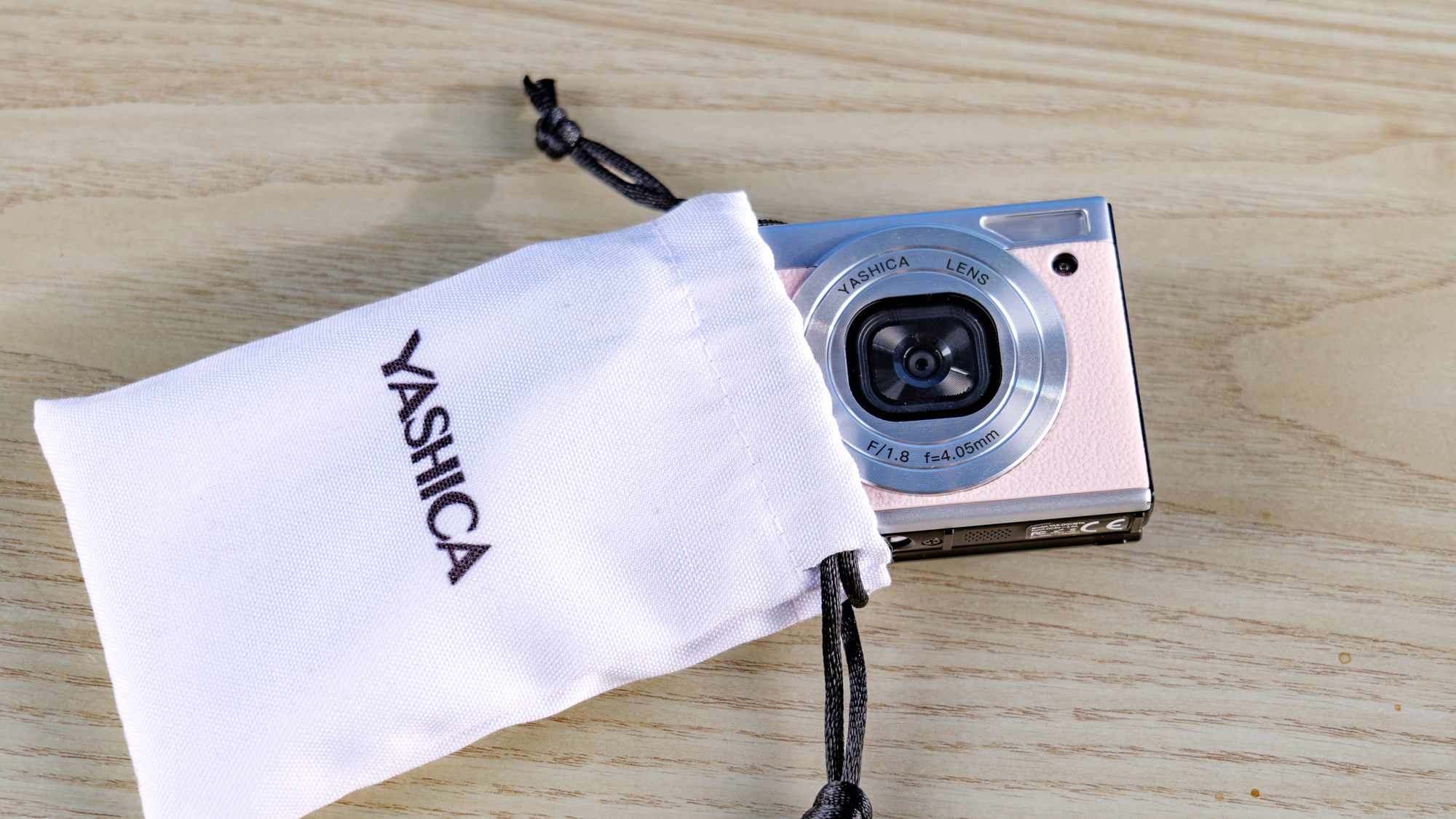 Yashica Tank in pink photographed in front of a blue background